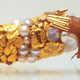Illustration for article titled Beautiful jewelry designed and crafted by fly larvae